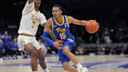 Mar 11, 2025; Charlotte, NC, USA; Pittsburgh Panthers guard Jaland Lowe (15) drives to the basket against Notre Dame Fighting Irish forward Tae Davis (7) during the first half at Spectrum Center. Mandatory Credit: Jim Dedmon-Imagn Images