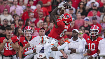 Oct 5, 2024; Athens, Georgia, USA; Georgia Bulldogs wide receiver Colbie Young (8) makes a catch over Auburn Tigers cornerback Kayin Lee (4) at Sanford Stadium. Mandatory Credit: Dale Zanine-Imagn Images