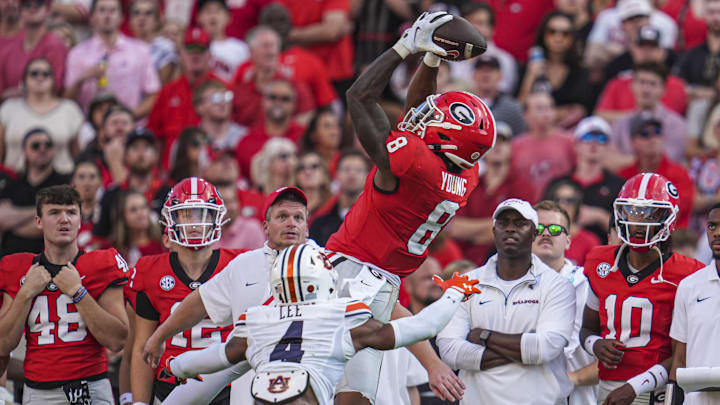 Oct 5, 2024; Athens, Georgia, USA; Georgia Bulldogs wide receiver Colbie Young (8) makes a catch over Auburn Tigers cornerback Kayin Lee (4) at Sanford Stadium. Mandatory Credit: Dale Zanine-Imagn Images