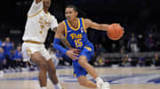 Mar 11, 2025; Charlotte, NC, USA; Pittsburgh Panthers guard Jaland Lowe (15) drives to the basket against Notre Dame Fighting Irish forward Tae Davis (7) during the first half at Spectrum Center. Mandatory Credit: Jim Dedmon-Imagn Images