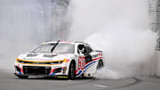 Jul 6, 2025; Chicago, Illinois, USA; NASCAR Cup Series driver Shane van Gisbergen (88) does a burnout after winning the Grant Park 165 at Chicago Street Race.