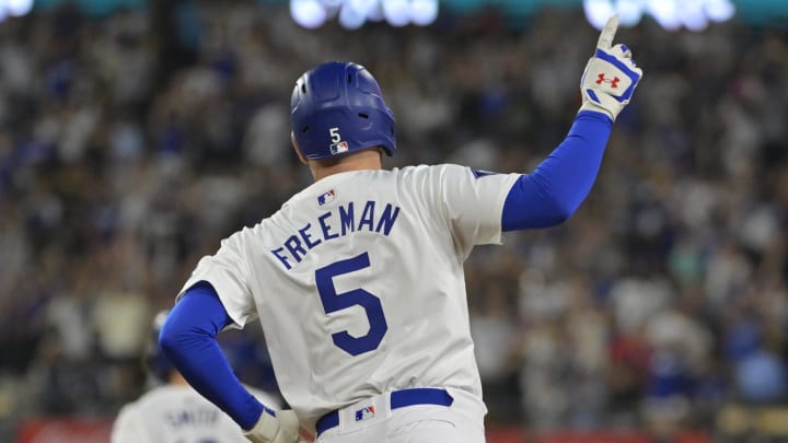 Jul 19, 2024; Los Angeles, California, USA;  Los Angeles Dodgers first base Freddie Freeman (5) celebrates after hitting a grand slam home run in the eighth inning against the Boston Red Sox at Dodger Stadium.