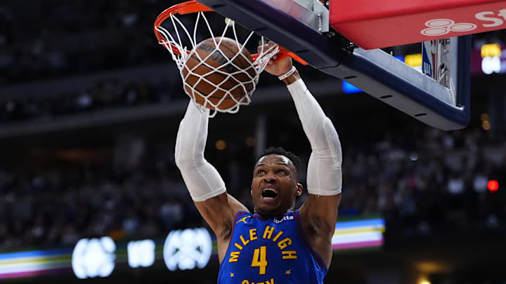 Denver Nuggets guard Russell Westbrook dunks the ball.