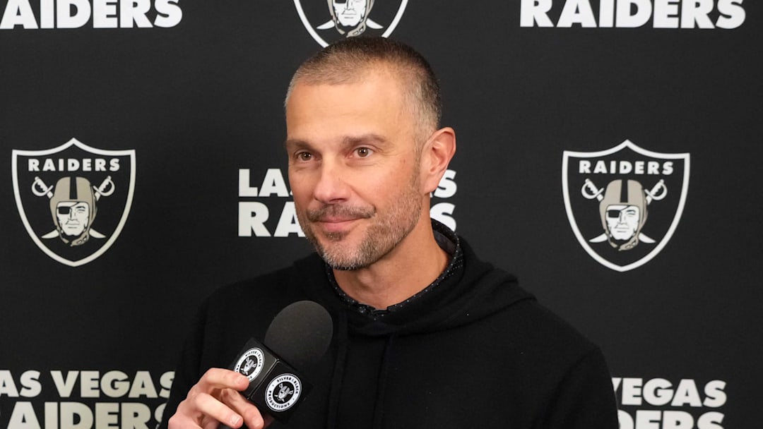 Feb 25, 2025; Indianapolis, IN, USA; Las Vegas Raiders general manager John Spytek (right) is interviewed by Raiders.com senior writer Eddie Paskal on radio row during the NFL Scouting Combine at the Indiana Convention Center. Mandatory Credit: Kirby Lee-Imagn Images