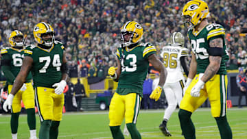 Green Bay Packers wide receiver Dontayvion Wicks (13) celebrates scoring a touchdown against the New Orleans Saints during their football game Monday, December 23, 2024, at Lambeau Field in Green Bay, Wisconsin.