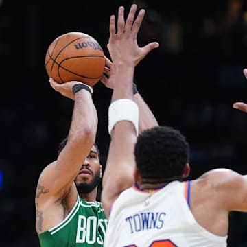 Boston Celtics forward Jayson Tatum shoots for three points against New York Knicks center Karl-Anthony Towns. Mandatory Credit: David Butler II-Imagn Images