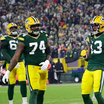 Green Bay Packers wide receiver Dontayvion Wicks (13) celebrates scoring a touchdown against the New Orleans Saints during their football game Monday, December 23, 2024, at Lambeau Field in Green Bay, Wisconsin.