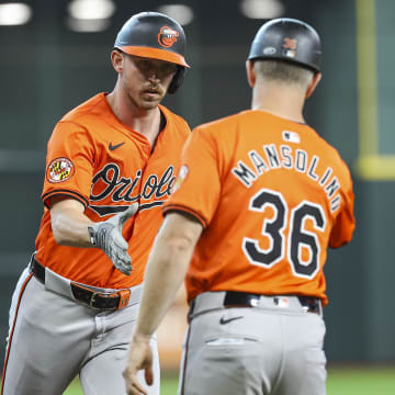 Baltimore Orioles second baseman Jordan Westburg (11) celebrates with third base coach Tony Mansolino (36) after hitting a home run during the second inning against the Houston Astros at Minute Maid Park on June 22.