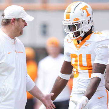 Tennessee head coach Josh Heupel greets players during warms up before the Orange & White spring game, Saturday, April 12, 2025.