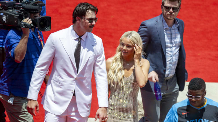 Jul 16, 2024; Arlington, Texas, USA; National League pitcher Paul Skenes of the Pittsburgh Pirates walks the red carpet with his girlfriend LSU gymnast Olivia Livvy Dunne before the 2024 MLB All-Star game at Globe Life Field. Mandatory Credit: Jerome Miron-USA TODAY Sports