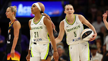 Jun 11, 2025; Phoenix, Arizona, USA; Dallas Wings guard DiJonai Carrington (21) with Paige Bueckers (5) against the Phoenix Mercury at PHX Arena. Mandatory Credit: Mark J. Rebilas-Imagn Images