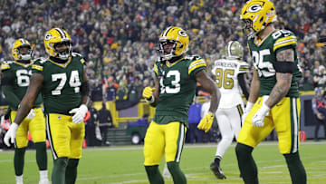 Dec 23, 2024; Green Bay, Wisconsin, USA;  Green Bay Packers wide receiver Dontayvion Wicks (13) celebrates scoring a touchdown against the New Orleans Saints at Lambeau Field. Mandatory Credit: Dan Powers-USA TODAY NETWORK/Imagn Images