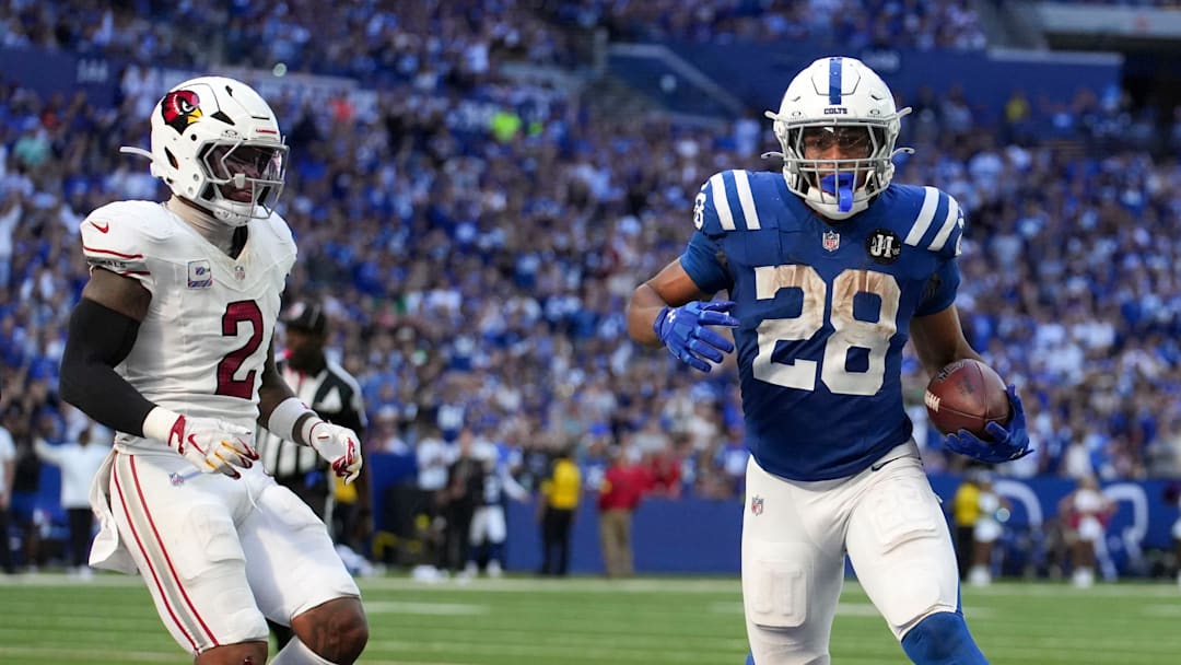 Arizona Cardinals linebacker Mack Wilson Sr. (2) watches as Indianapolis Colts running back Jonathan Taylor (28) scores a touchdown during a game on Sunday, Oct. 12, 2025, at Lucas Oil Stadium in Indianapolis. The Colts defeated the Cardinals 31-27.