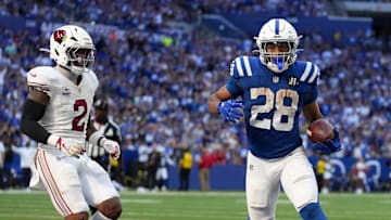 Arizona Cardinals linebacker Mack Wilson Sr. (2) watches as Indianapolis Colts running back Jonathan Taylor (28) scores a touchdown during a game on Sunday, Oct. 12, 2025, at Lucas Oil Stadium in Indianapolis. The Colts defeated the Cardinals 31-27.