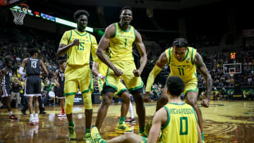 Oregon Ducks N'Faly Dante and Rivaldo Soares celebrate after teammate Will Richardson was fouled and scored. 