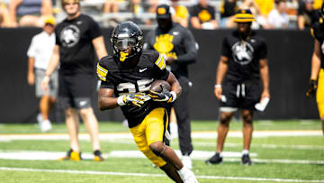 Aug 9, 2025; Iowa running back Nathan McNeil (25) runs a drill during the Hawkeyes Kids Day NCAA football open practice at Kinnick Stadium in Iowa City, Iowa. Mandatory Credit: Joseph Cress for the Des Moines Register