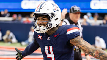 Nov 22, 2025; Tucson, Arizona, USA; Arizona Wildcats wide receiver Kris Hutson (4) celebrates against the Baylor Bears at Casino Del Sol Stadium. Mandatory Credit: Mark J. Rebilas-Imagn Images