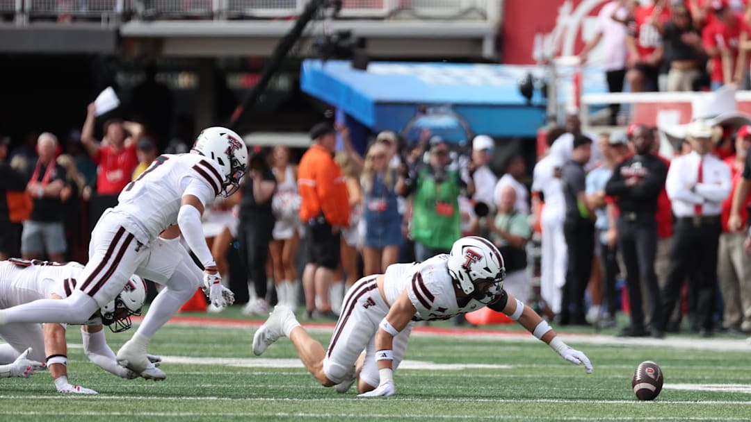 Sep 20, 2025; Salt Lake City, Utah, USA; Texas Tech Red Raiders linebacker John Curry (6) dives for a fumble by the Utah Utes during the first quarter at Rice-Eccles Stadium. Mandatory Credit: Rob Gray-Imagn Images