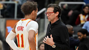 Trae Young # 11 and head coach Quin Snyder of the Atlanta  Hawks