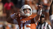 Texas Longhorns quarterback Arch Manning (16) reacts after throwing a touchdown pass in the first half against the Arkansas Razorbacks at Darrell K Royal-Texas Memorial Stadium.