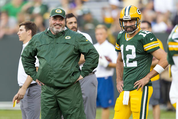 Green Bay Packers head coach Mike McCarthy talks with quarterback Aaron Rodgers.