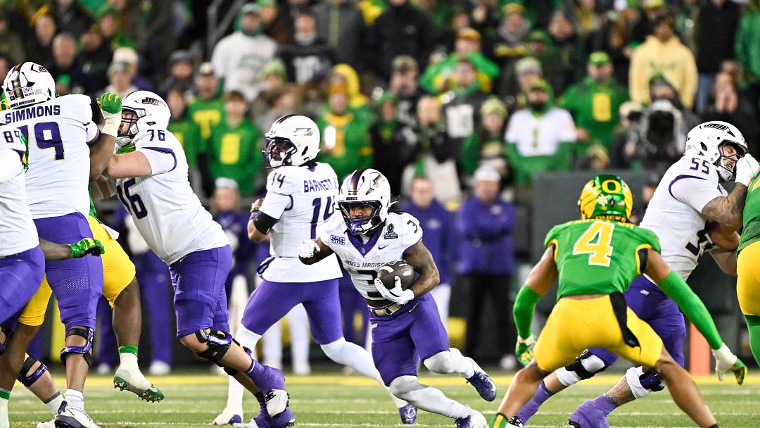 Dec 20, 2025; Eugene, OR, USA; James Madison Dukes running back Wayne Knight (3) rushes during the third quarter against the Oregon Ducks at Autzen Stadium. Mandatory Credit: Craig Strobeck-Imagn Images