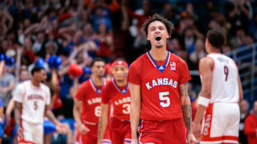 Mar 8, 2025; Lawrence, Kansas, USA; Kansas Jayhawks guard Zeke Mayo (5) reacts after a play against the Arizona Wildcats during the first half at Allen Fieldhouse. Mandatory Credit: William Purnell-Imagn Images