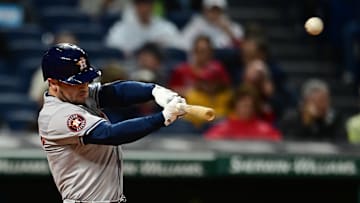 Sep 27, 2024; Cleveland, Ohio, USA; Houston Astros third baseman Alex Bregman (2) hits a sacrifice fly during the first inning against the Cleveland Guardians at Progressive Field. Mandatory Credit: Ken Blaze-Imagn Images