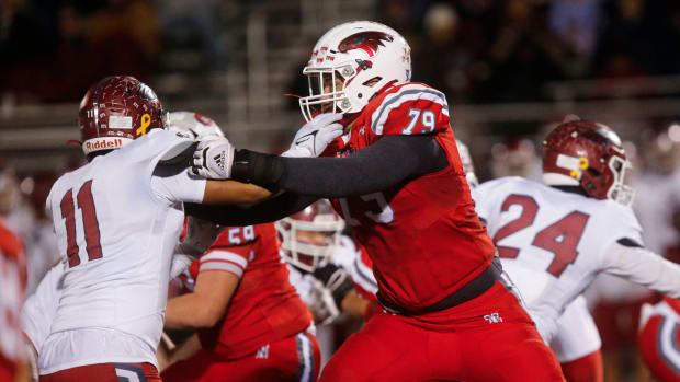 Nixa Eagles lineman Jackson Cantwell holds back a Joplin defender during the high school football championship game in 2023.