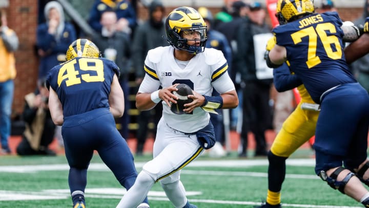 Blue Team quarterback Jadyn Davis (2) looks to pass against Maize Team during the second half of the spring game at Michigan Stadium in Ann Arbor on Saturday, April 20, 2024.