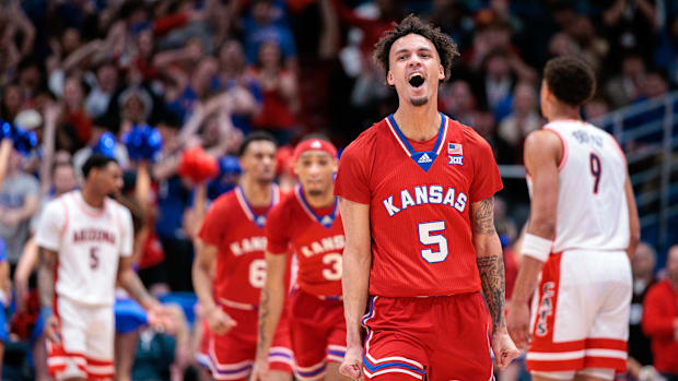 Zeke Mayo celebrates a Kansas basket against Arizona on senior da