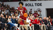 Jan 25, 2025; Tuscaloosa, Alabama, USA; Alabama Crimson Tide guard Labaron Philon (0) drives the ball against the LSU Tigers during the second half at Coleman Coliseum. Mandatory Credit: Will McLelland-Imagn Images
