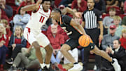 Nov 18, 2024; Fayetteville, Arkansas, USA; Arkansas Razorbacks forward Karter Knox (11) defends against Pacific Tigers guard Elijah Fisher (22) during the second half at Bud Walton Arena. Arkansas won 91-72. Mandatory Credit: Nelson Chenault-Imagn Images