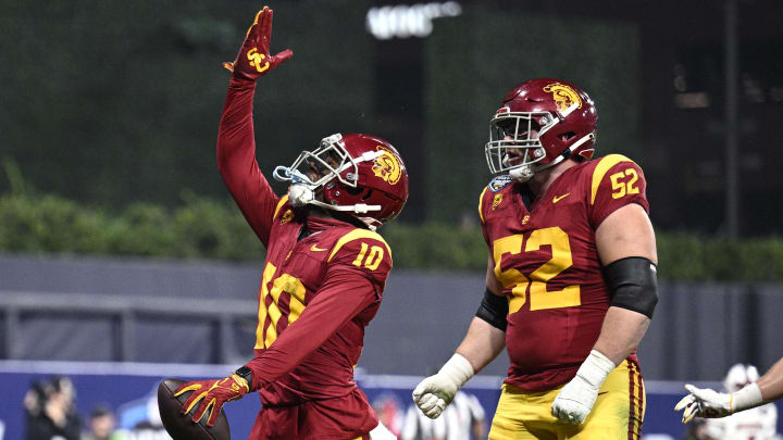 Dec 27, 2023; San Diego, CA, USA; USC Trojans wide receiver Kyron Hudson (10) celebrates after scoring a touchdown against the Louisville Cardinals during the first half at Petco Park. Mandatory Credit: Orlando Ramirez-USA TODAY Sports