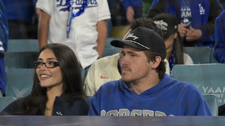 Oct 27, 2025; Los Angeles, California, USA; Los Angeles Chargers quarterback Justin Herbert with his girlfriend Madison Beer during game three of the 2025 MLB World Series between the Toronto Blue Jays and the Los Angeles Dodgers at Dodger Stadium. Mandatory Credit: Jayne Kamin-Oncea-Imagn Images