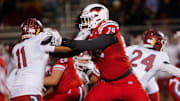 Nixa Eagles Jackson Cantwell holds back a Joplin defender during the championship game of Class 6 District 5 football at Nixa on Friday, Nov. 11, 2023.