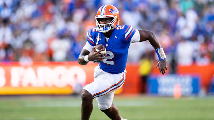 Aug 31, 2024; Gainesville, Florida, USA; Florida Gators quarterback DJ Lagway (2) runs with the ball against the Miami Hurricanes during the second half at Ben Hill Griffin Stadium. Mandatory Credit: Matt Pendleton-Imagn Images