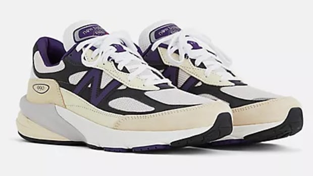 White and purple New Balance sneakers.