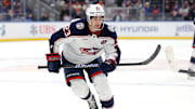 Mar 24, 2025; Elmont, New York, USA; Columbus Blue Jackets center Sean Monahan (23) skates against the New York Islanders during the second period at UBS Arena. Mandatory Credit: Brad Penner-Imagn Images