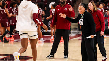 Dec 7, 2025; Columbia, South Carolina, USA; South Carolina Gamecocks head coach Dawn Staley high fives her players before the game against the North Carolina Central Eagles in the first half at Colonial Life Arena. Mandatory Credit: Jeff Blake-Imagn Images
