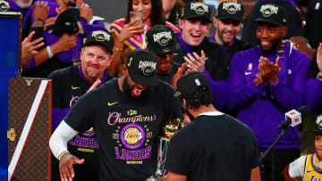 Oct 11, 2020; Lake Buena Vista, Florida, USA; Los Angeles Lakers forward LeBron James (23) shakes hands with forward Anthony Davis (3) after receiving the MVP award after game six of the 2020 NBA Finals at AdventHealth Arena. The Los Angeles Lakers won 106-93 to win the series. Mandatory Credit: Kim Klement-USA TODAY Sports