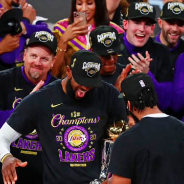 Oct 11, 2020; Lake Buena Vista, Florida, USA; Los Angeles Lakers forward LeBron James (23) shakes hands with forward Anthony Davis (3) after receiving the MVP award after game six of the 2020 NBA Finals at AdventHealth Arena. The Los Angeles Lakers won 106-93 to win the series. Mandatory Credit: Kim Klement-USA TODAY Sports