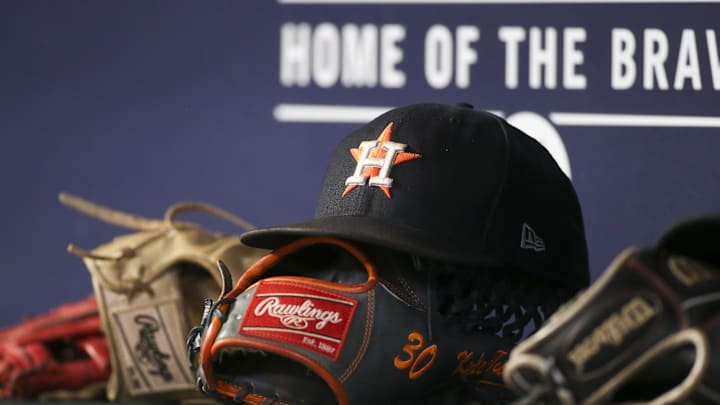 Aug 20, 2022; Atlanta, Georgia, USA; A detailed view of the hat and glove of Houston Astros right fielder Kyle Tucker (not pictured) against the Atlanta Braves in the eleventh inning at Truist Park. Mandatory Credit: Brett Davis-Imagn Images