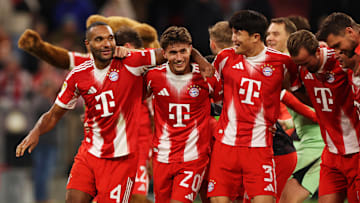 Bayern Munich players celebrating after 2-1 win against Borussia Dortmund.