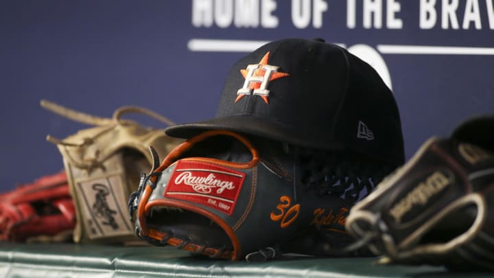 A detailed view of the hat and glove of Houston Astros