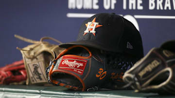 Aug 20, 2022; Atlanta, Georgia, USA; A detailed view of the hat and glove of Houston Astros right fielder Kyle Tucker (not pictured) against the Atlanta Braves in the eleventh inning at Truist Park. Mandatory Credit: Brett Davis-Imagn Images