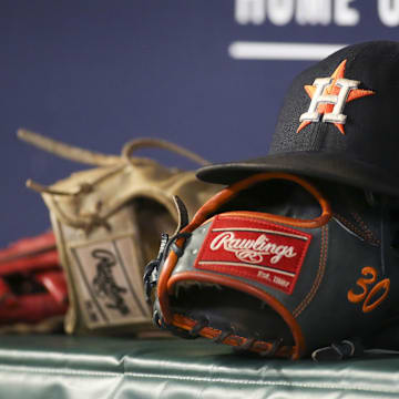 Aug 20, 2022; Atlanta, Georgia, USA; A detailed view of the hat and glove of Houston Astros right fielder Kyle Tucker (not pictured) against the Atlanta Braves in the eleventh inning at Truist Park.