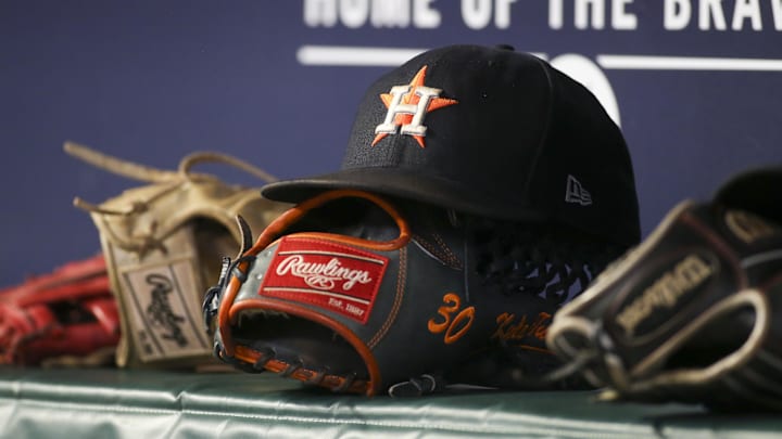 Aug 20, 2022; Atlanta, Georgia, USA; A detailed view of the hat and glove of Houston Astros right fielder Kyle Tucker (not pictured) against the Atlanta Braves in the eleventh inning at Truist Park. Aug 20, 2022; Atlanta, Georgia, USA; A detailed view of the hat and glove of Houston Astros right fielder Kyle Tucker (not pictured) against the Atlanta Braves in the eleventh inning at Truist Park.
