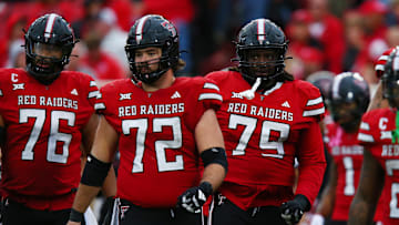 Oct 19, 2024; Lubbock, Texas, USA;  Texas Tech Red Raiders offensive lineman Caleb Rogers (76), offensive center Sheridan Wilson (72) and offensive lineman Sterling Porcher (79) run onto the field in the second half against the Baylor Bears at Jones AT&T Stadium and Cody Campbell Field. Mandatory Credit: Michael C. Johnson-Imagn Images