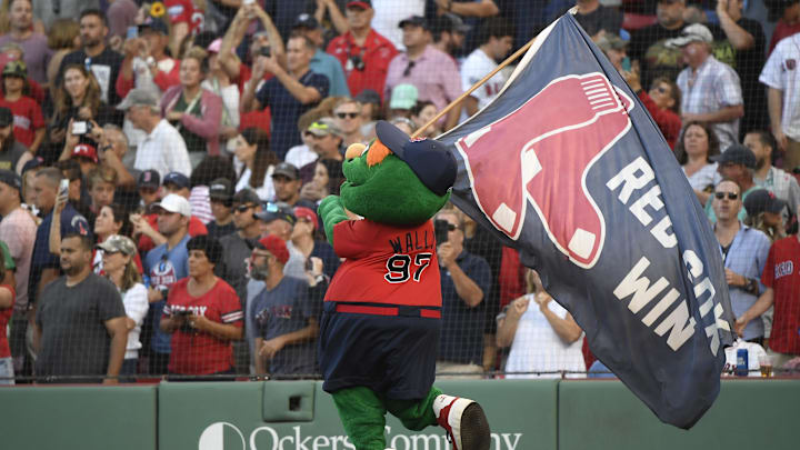 Aug 27, 2022; Boston, Massachusetts, USA;  Boston Red Sox mascot Wally waves a banners after the Red Sox defeated the Tampa Bay Rays at Fenway Park. Mandatory Credit: Bob DeChiara-Imagn Images